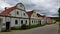 Traditional houses in village called Holasovice in South Bohemia lined up by the road going around village square