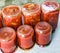 Traditional Hungarian homemade lecho in glass jars. Preserved tomatoes and peppers with spices