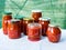 Traditional Hungarian homemade lecho in glass jars. Preserved tomatoes and peppers with spices