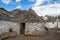 Traditional huts with a conical roof in Italy