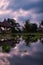 Traditional Huts and Reflections by the Pond in Ubud\\\'s Serene Twilight