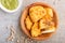 Traditional indian food paneer pakora in wooden  plate with mint chutney on a gray concrete background. top view