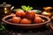 Traditional Indian food, sweet Gulab Jamun balls with mint leaves in a clay plate
