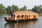 Traditional Indian houseboat cruising near Alleppey on Kerala ba