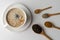 Traditional indian masala chai tea with spices - cinnamon, cardamom, anise, white background. Top view copy space