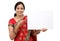 Traditional Indian woman holding a blank billboard