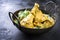 Traditional Indian yellow chicken curry in a korai