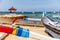 Traditional Indonesian outrigger style wooden fishing boat jukung on the beach at Sanur, Bali, Indonesia.