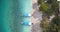 Traditional Indonesian wooden boats, moored on tropical island beach, aerial