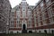 Traditional inner courtyard surrounded by tall and old red brick walls. old building, vintage Dutch style. fascinating amsterdam