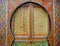 Traditional, intricately patterned, colourfully painted door in Fez, Morocco