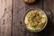 Traditional Irish dish colcannon, mashed potatoes with cabbage and green onions, on top of crispy fried cabbage topping with nuts