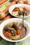 Traditional irish lamb stew with potato, carrot, celery and spr