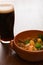 Traditional Irish Stew and a pint of beer in backlit