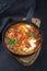 Traditional Israeli national dish shakshouka offered as breakfast with poached eggs in tomato sauce with chili and onions