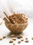 Traditional Italian biscotti Almond Cantuccini in a basket decorated with nuts on wooden table