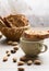 Traditional Italian biscotti Almond Cantuccini in a basket decorated with nuts on wooden table