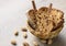 Traditional Italian biscotti Almond Cantuccini in a basket decorated with nuts on wooden table