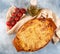 Traditional italian cannelloni with vegetables, minced meat and cheese. On a wooden background. Top view, copy space