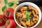Traditional italian dish: pasta alla norma with tomatoes, eggplant, garlic, basil and ricotta cheese