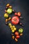 Traditional Italian fresh tomato collection on a rustic black board