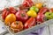 Traditional Italian fresh tomato collection on a shabby chic wooden tray