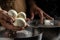 Traditional Italian mozzarella in hand. Cheesemaker, showing freshly made mozzarella