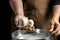 Traditional Italian mozzarella in hand. Cheesemaker, showing freshly made mozzarella