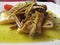 Traditional italian Paccheri pasta with artichokes and pistachios