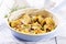 Traditional Italian paccheri pasta filled with minced meat with parmesan in a design pan