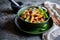 Traditional Italian Pasta alla Norma with eggplant, tomato, cheese and basil