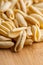 Traditional Italian pasta cavatelli on the kitchen wooden table. Selective focus. Shallow depth of field