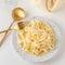 Traditional Italian pasta - Fetuccini Alfredo on a white table with golden appliances