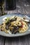 Traditional Italian pasta pappardelle alla melanzane on on a design plate