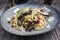 Traditional Italian pasta pappardelle alla melanzane on on a design plate