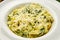 Traditional italian Pasta tagliatelli with spinach, hard parmesan cheese and cream sauce