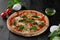 Traditional Italian pizza Margherita with tomatoes, mozzarella, basil