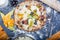 Traditional italian pizza with mozzarella, salami, ricotta and pumpkin flowers