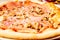 Traditional Italian pizza in pizzeria in Italy, gastronomic travel experience