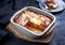 Traditional Italian polenta alla sarda con salsiccia with ground meat ragu and pecorino on a ceramic design plate