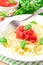 Traditional Italian tasty meal pasta with tomato sauce and basil