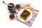 Traditional Italian Tiramisu dessert square portion on ceramic plate, coffee mill grinder and savoiardi cookies a