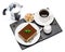 Traditional Italian Tiramisu dessert square portion on ceramic plate, mocha coffee maker, milk or cream, sugar and cup