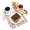 Traditional Italian Tiramisu dessert square portion on ceramic plate, savoiardi cookies and cup of fresh espresso coffee