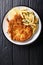 Traditional Italian veal Milanese with lemon and French fries cl