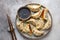 Traditional japaneese gyoza dumplings with meat and mushrooms on ceramic plate