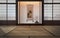 Traditional japanese empty room interior with tatami mats and sun light.