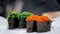 Traditional Japanese food. close-up. professional Sushi Chef is putting various freshly prepared sushi rolls in a