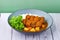 Traditional japanese food Rice Lion Mane Cheesy Patty Curry in a bowl on wooden table