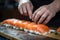 In a traditional Japanese kitchen, a chef\\\'s hands expertly prepare sushi